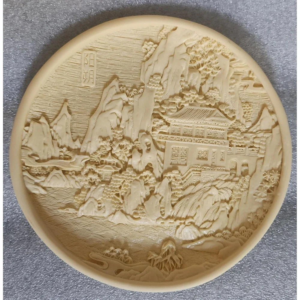 Vintage Chinese carved resin decorative plate with a landscape motif